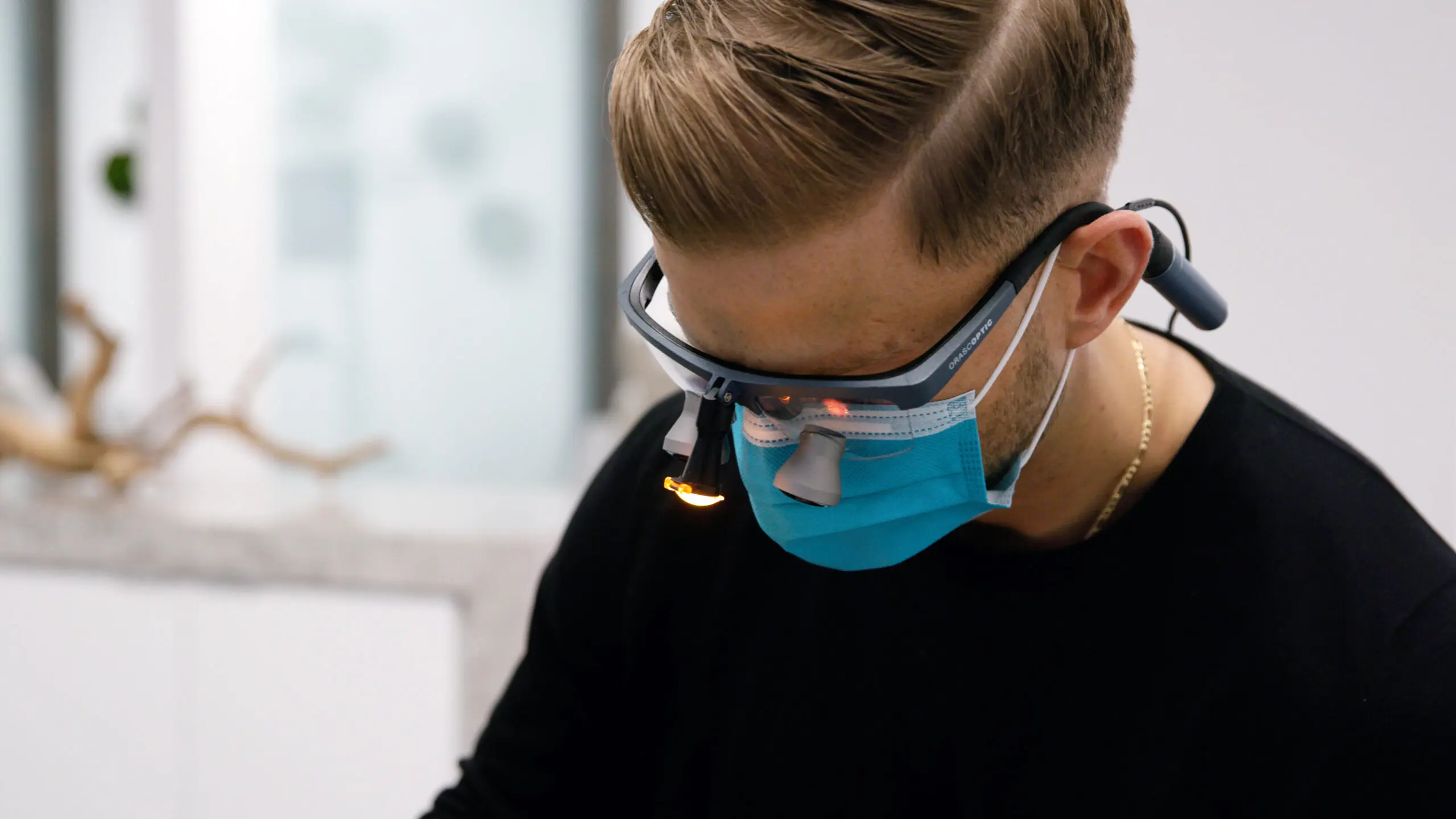 Dr. Fredal closeup working on a patient